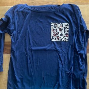 Blue long sleeve sleeping shirt with a cheetah print pocket. Size large.